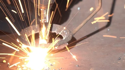 Dross sparks scatter during plasma cutting process closeup Stock Footage 118524641