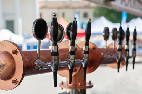 Drought beer taps in a bar. Stock Photos