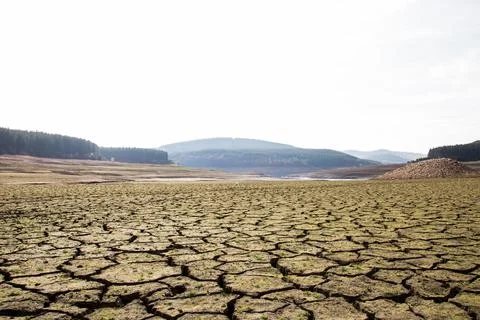 The drought bottom of the an empty dam in Bulgaria. Hot weather and climate Stock Photos