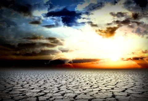 Drought cracks, a cold sunset, a dead planet Stock Photos