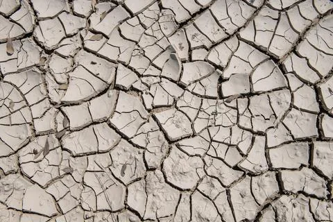 Drought creates deep cracks in soil Stock Photos