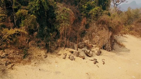 Drought triggered by climate change. Deforestation of rainforest in Asia. Aerial Stock Footage 127616698