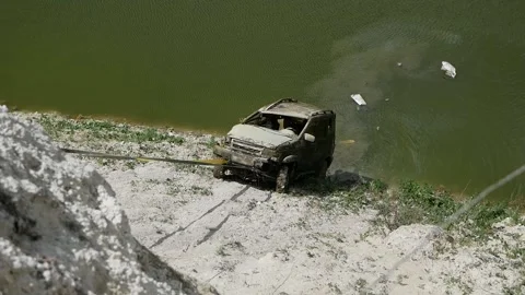 Drowned jeep car is pulled out of the water Stock Footage 146648982