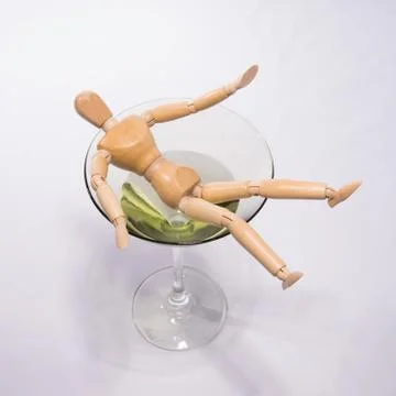 Drowning in alcohol Stock Photos