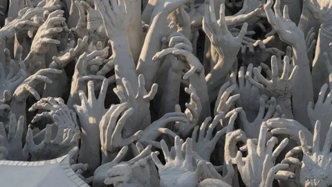 Drowning people in hell hands sculpture in white temple,Chiang Rai,Thailand Stock Footage 100346532