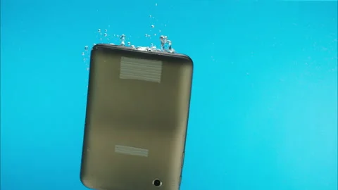 Drowning smartphone in water close-up, throwing mobile phone into a river or Video stock 156670496