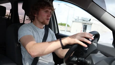 Drowsy driver falls asleep and suddenly wakes up behind the wheel Stock Footage 343719922