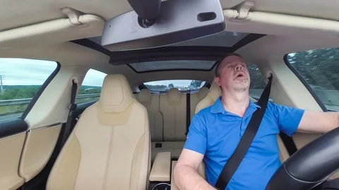 Drowsy Driver falls asleep at the wheel Stock Footage 91717404