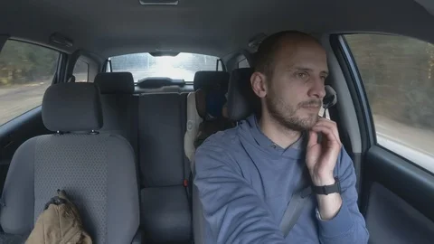 Drowsy Man Driving a Car with baby. Male Driver Falling Asleep. 스톡 동영상 106923975