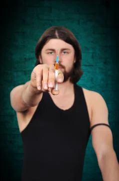 Drug addict with syringe Foto stock