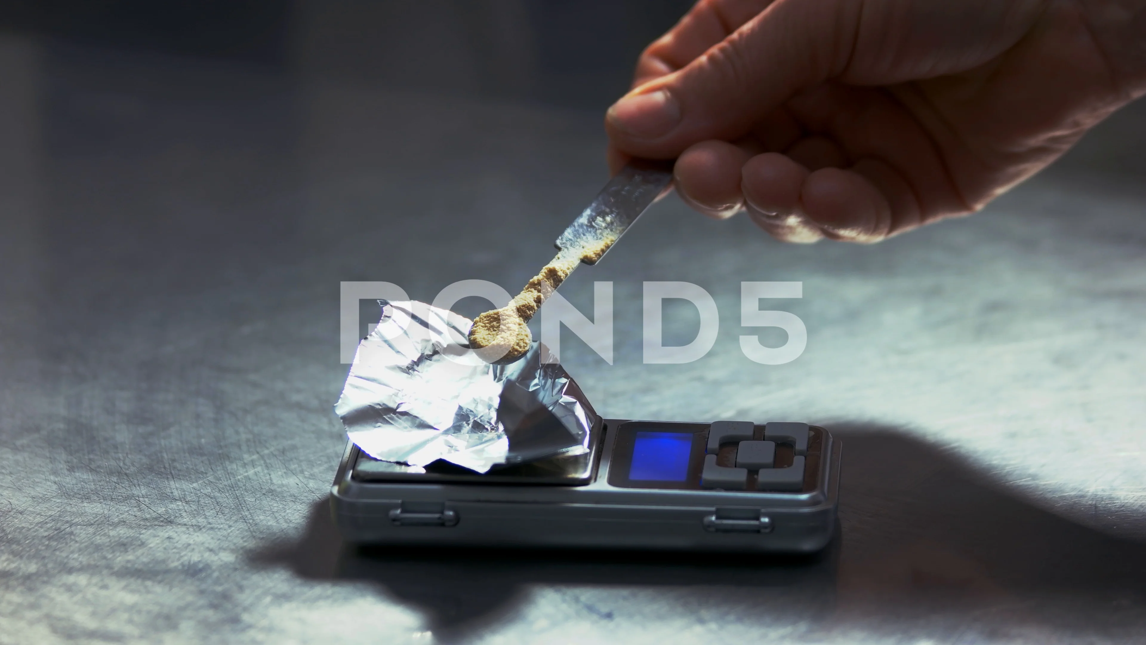 https://images.pond5.com/drug-dealer-weighing-drug-digital-footage-102274769_prevstill.jpeg