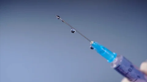 Drug is leaking from a syringe. Stock Footage 74178023