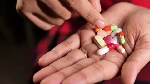 Drug over dose Concept Many Pills. Macro Of Hand Holding Several Pill Healthcare Stock Footage 336586348