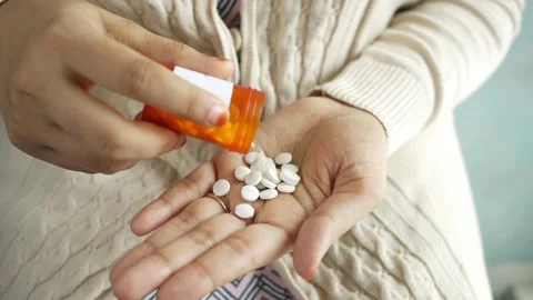 Drug over dose Concept Many Pills. Macro Of female Hand Holding Several Pill Stock-Footage 336586514