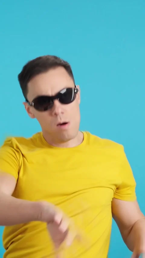 Drugged man with sunglasses dancing uncontrollably blacks out Stock Footage 258204881