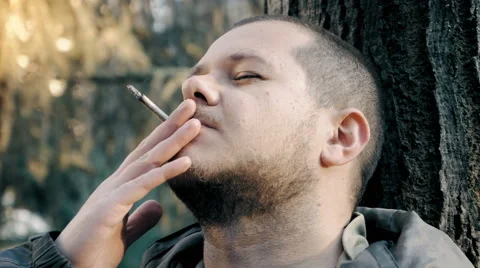 Drugs addict, man smoking weed, joint Stockbeeldmateriaal 59509095