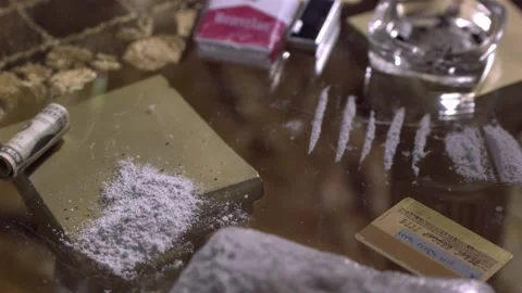 Drugs cocaine slow motion glass breaking Stock Footage