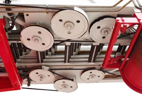 Drum with a cable for lifting stairs on a fire truck Stock Photos