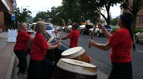 A drum corps performing on the street downtown Stock Footage 68763353
