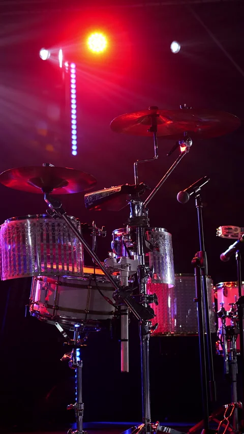 Drum Kit on Concert Stage Under Colorful Stage Lights Stock Footage 345560363