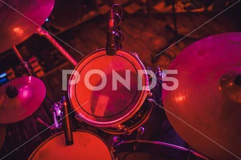 Drum kit on stage in the spotlight color. Stock Photos