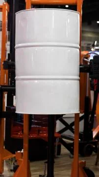 Drum lifted by drum stacker Stock Photos