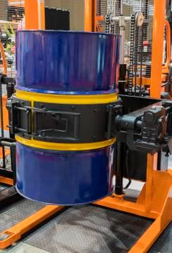 Drum lifted by drum stacker Stock Photos