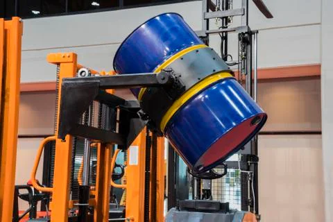 Drum lifted by drum stacker Stock Photos