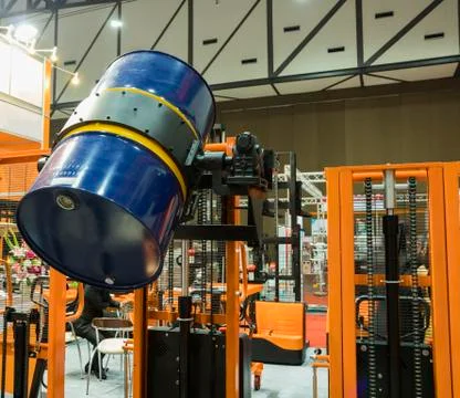 Drum lifted by drum stacker Stock Photos