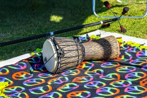 A drum lying on a blanket in the park Stock-Fotos
