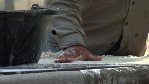 A Drum Maker Wetting Goatskin Membrane while making A Leguero Bass Drum. Stock Footage 218331274