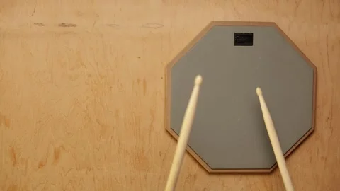 Drum practice pad with sticks for quiet rhythmic training and skill development Stock Footage 341737655