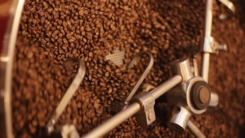 In drum of roaster blades slowly rotate to ensure that coffee beans are roasted Vidéo 308387934
