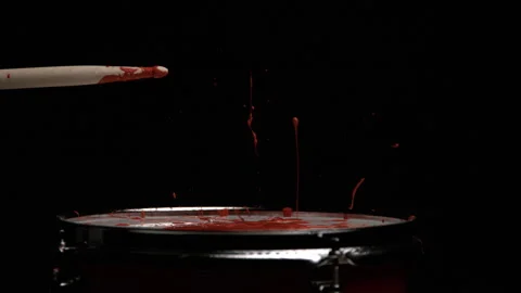 Drum Stick Hits Drum with Red Paint Splashing up Stock Footage 270404643