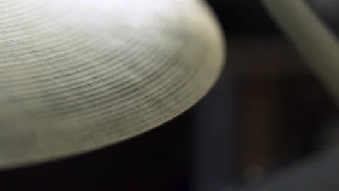 Drum stick hitting crash cymbal in slow motion Stock Footage 230189482