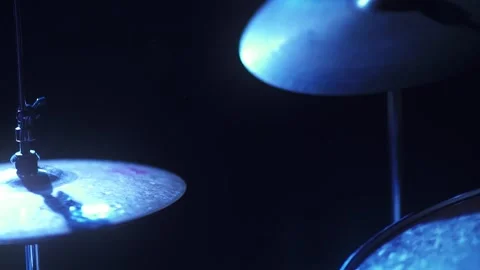 Drumer playing in blue light and slow motion Stock Footage 318551902