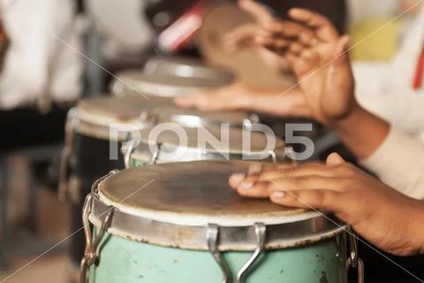 A Drummer in Action - Playing Bongo Stock Photos