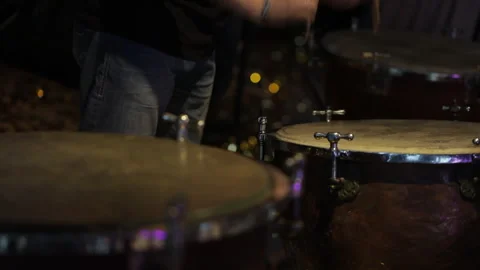 The drummer actively taps the drum with his sticks Stock Footage 252829677