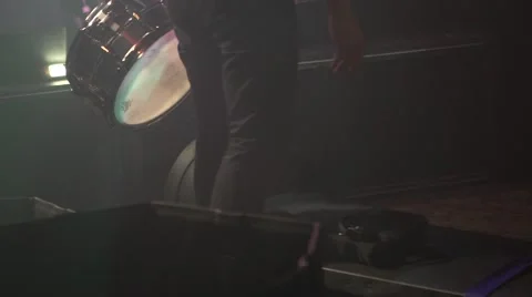Drummer assembling drums on stage in night club Stock-Footage 50663935