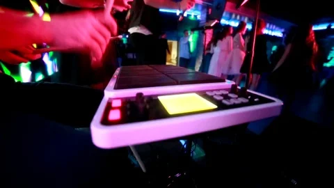 Drummer bangs drumsticks on drum kit. Electronic musical instrument, slow motion Stock Footage 129682935