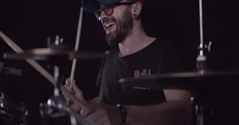 Drummer with cap playing drums in slow motion with amazing vibes Stock Footage