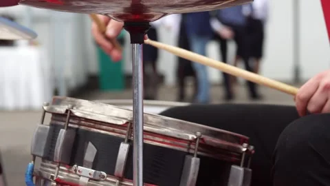 Drummer drumming with drumsticks during a performance, close-up. Copy space for Stock Footage 306365490
