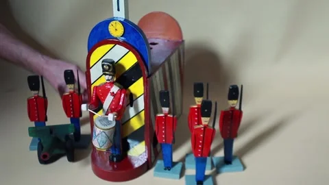 Drummer is drumming next to the brave guards with a cannon Stock Footage 302253207