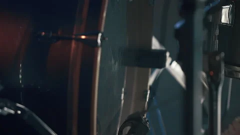 A drummer is drumming in the Studio. Plays the kick drum pedal. Stock Footage 219645364