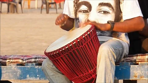 Drummer with the face of Bob Marley T-shirt, beats Jamaican rhythms. Stock Footage 47762154