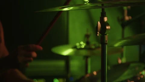 Drummer hits on the drums with mallets drumsticks. Young man playing drums on Stock Footage 168743617