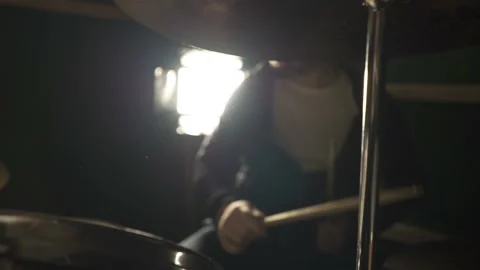 The drummer hits the wet drum. Slow motion Stock Footage 155437793