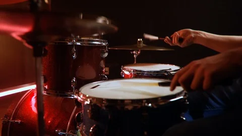 Drummer, jazz lesson swing, on red drums , low key, red light. Stock Footage 105455400