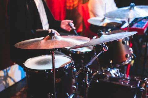 Drummer percussionist performing on a stage with drum set kit during jazz roc Stock Photos