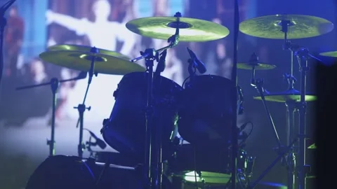 A drummer performing on a dimly lit stage. Stock Footage 254718431